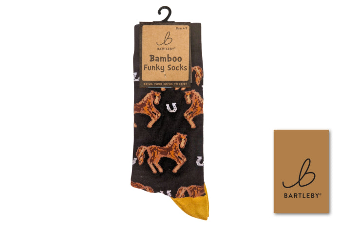 A packaged pair of Bartleby Bamboo Funky Socks featuring a black background with brown horse illustrations, white horseshoes, and a yellow toe and heel. A kraft paper hang tag and a small square brand card are shown on a white background.